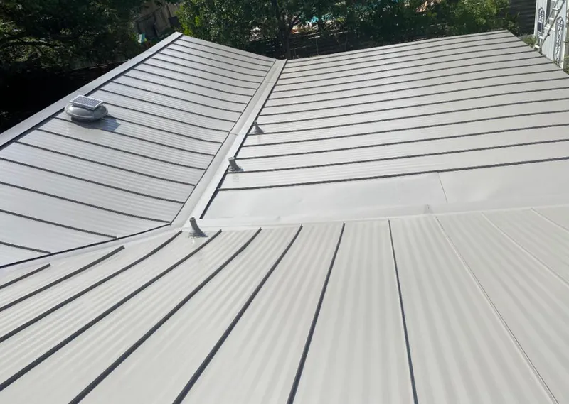 Solar attic fan installed on a metal roof for Roof Ventilation in Haiku-Pauwela